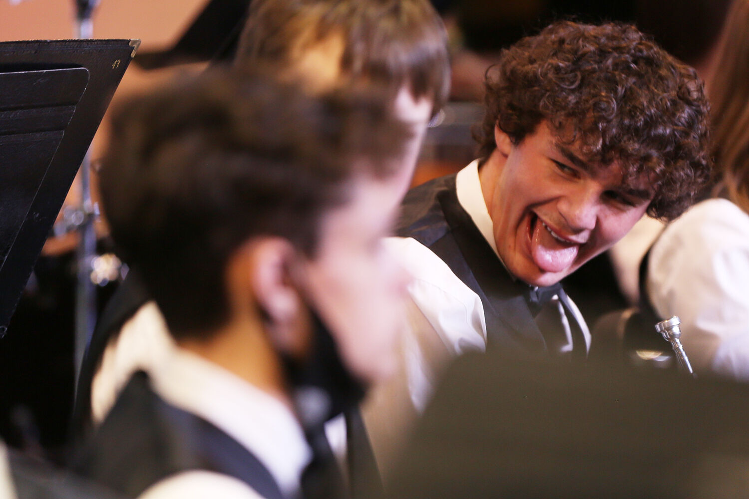 Jace Skovgard laughs with other members of the trumpet section